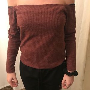 Long sleeve off the shoulder shirt.
